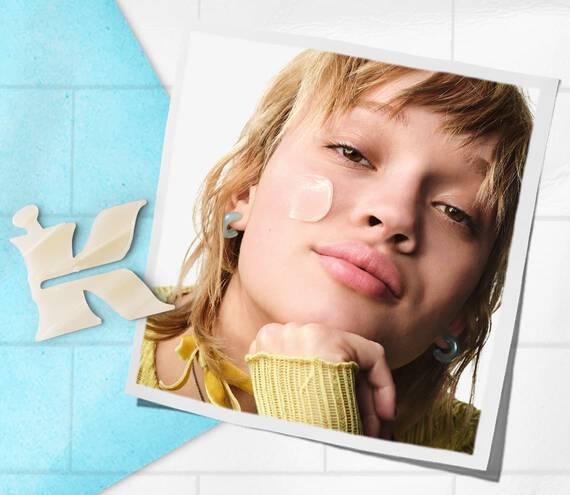 Kiehl’s branded photo of model with a formula on their cheek