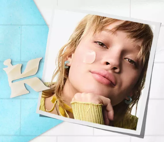 Kiehl’s branded photo of model with a formula on their cheek